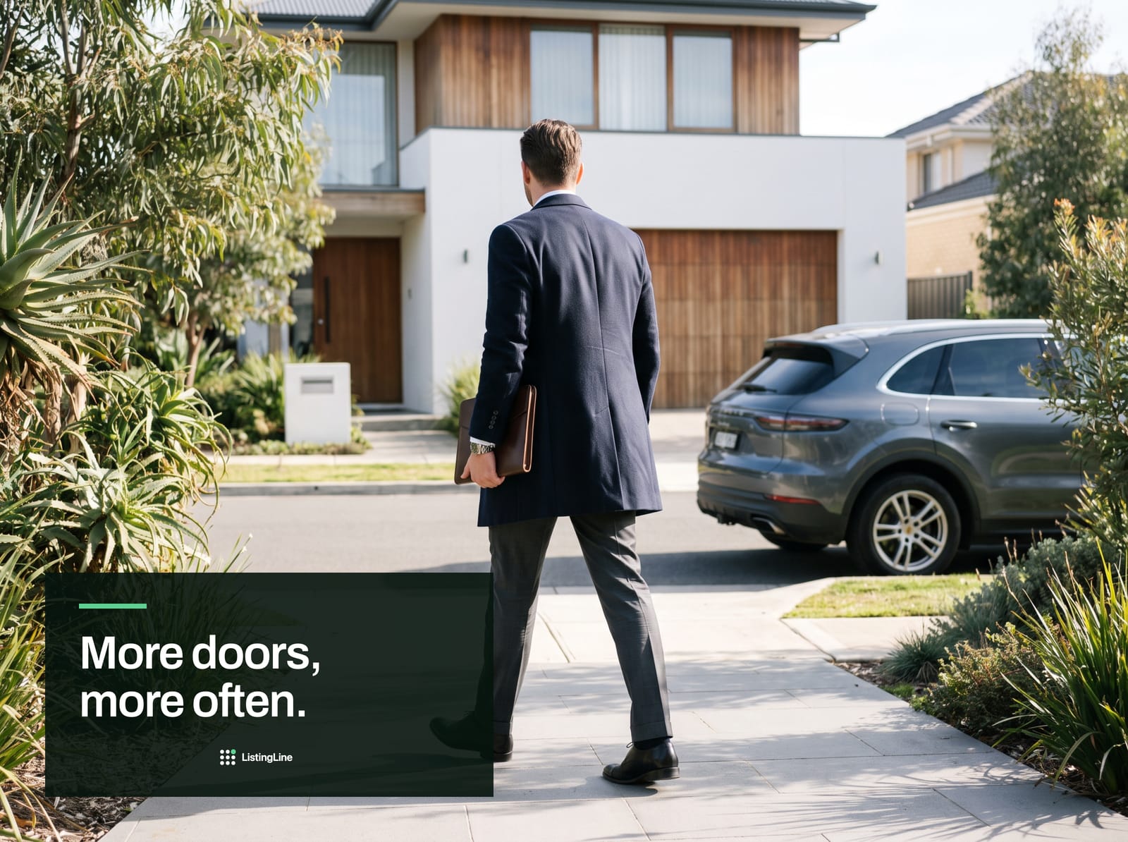 More doors, more often. An agent standing at the front path of a modern home, folio under his arm.